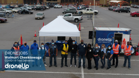 A group of people, including DroneUp pilots, outside a Walmart in Cheektowaga, New York.